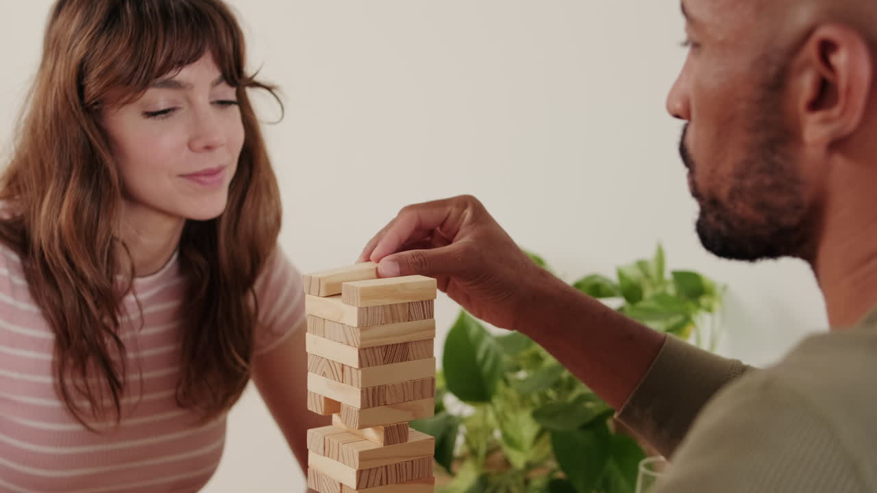 Couple Playing Jenga at Home