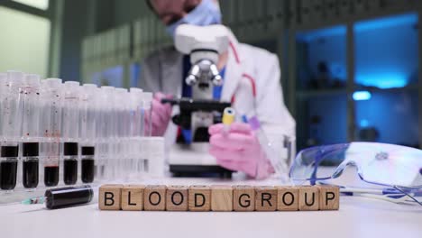 scientist performing blood group analysis in a laboratory