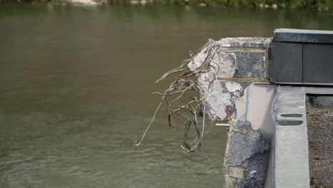 Close-up-shot-of-a-demolished-building-by-a-river