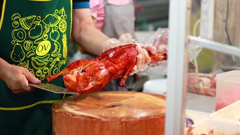 chef skillfully prepares roast duck for serving