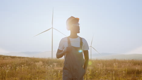 wind turbine engineer at sunrise