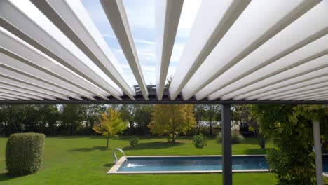 slow motion dolly shot of an open sun patio in the garden of a villa