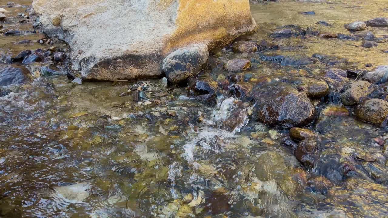 Water Flowing Over Small Rocks In Skardu