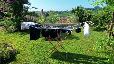 clothes drying on rack in scenic vineyard