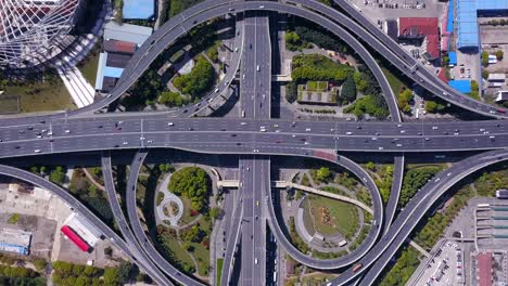 aerial view of highway junctions with roundabout. bridge roads shape circle in structure of architecture and transportation concept. top view. urban city, shanghai, china.