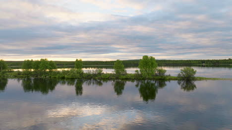 Beautiful-drone-shot-of-sky-reflecting-in-lake-water-in-Sweden