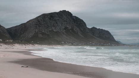beach scene with mountains on a moody day