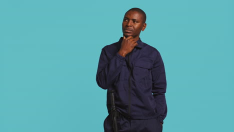 portrait of pensive bodyguard rubbing chin, doing thinking hand gesture