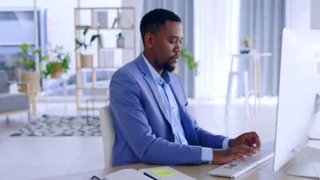 Black-man,-accountant-and-typing-on-computer