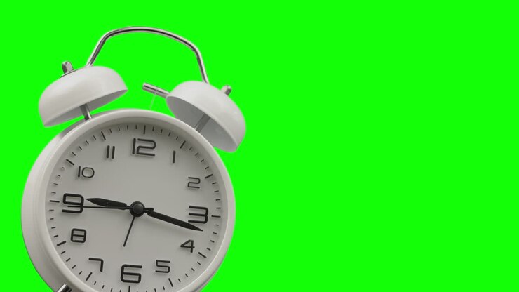 Time Lapse 4K of close up traditional alarm clock with green screen background and copy space shows concept of time passing in waking up and rush hour morning for doing work and business.