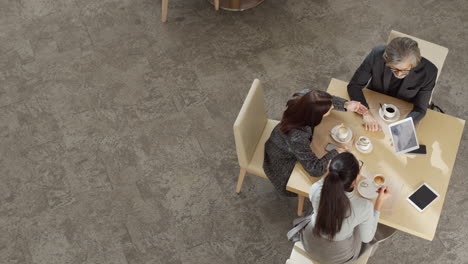 top-view of business partners at lunch