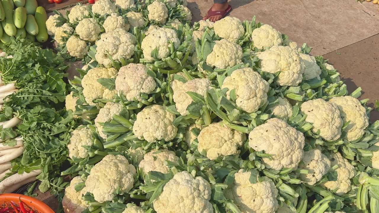 A huge pile of freshly harvested culiflower