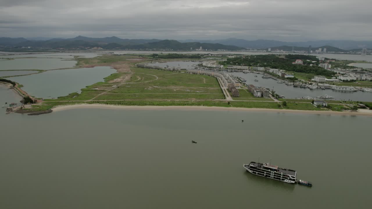 Ha long bay bird&#x27;s eye view, view of harbor and water area with cruise ship sailing. Vietnam