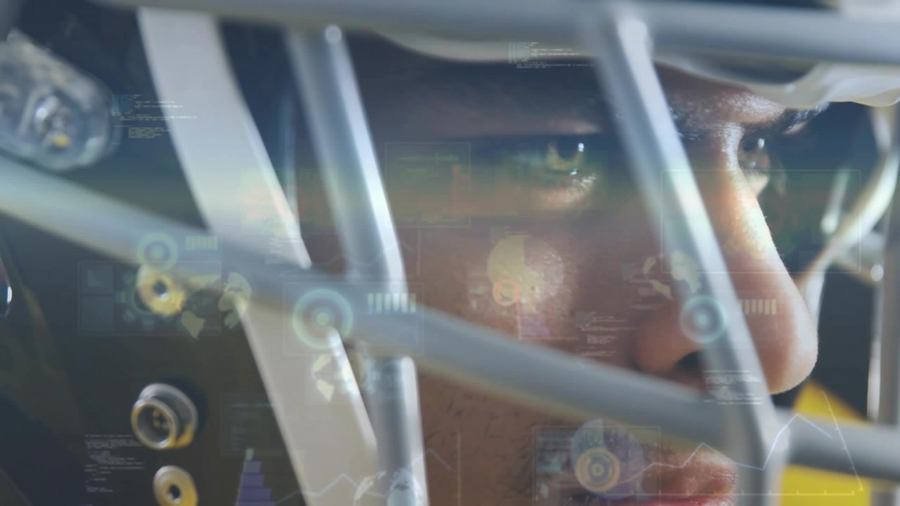 Male athlete adjusting gaze, camera moving, HUD overlays expanding on facemask for sports analysis