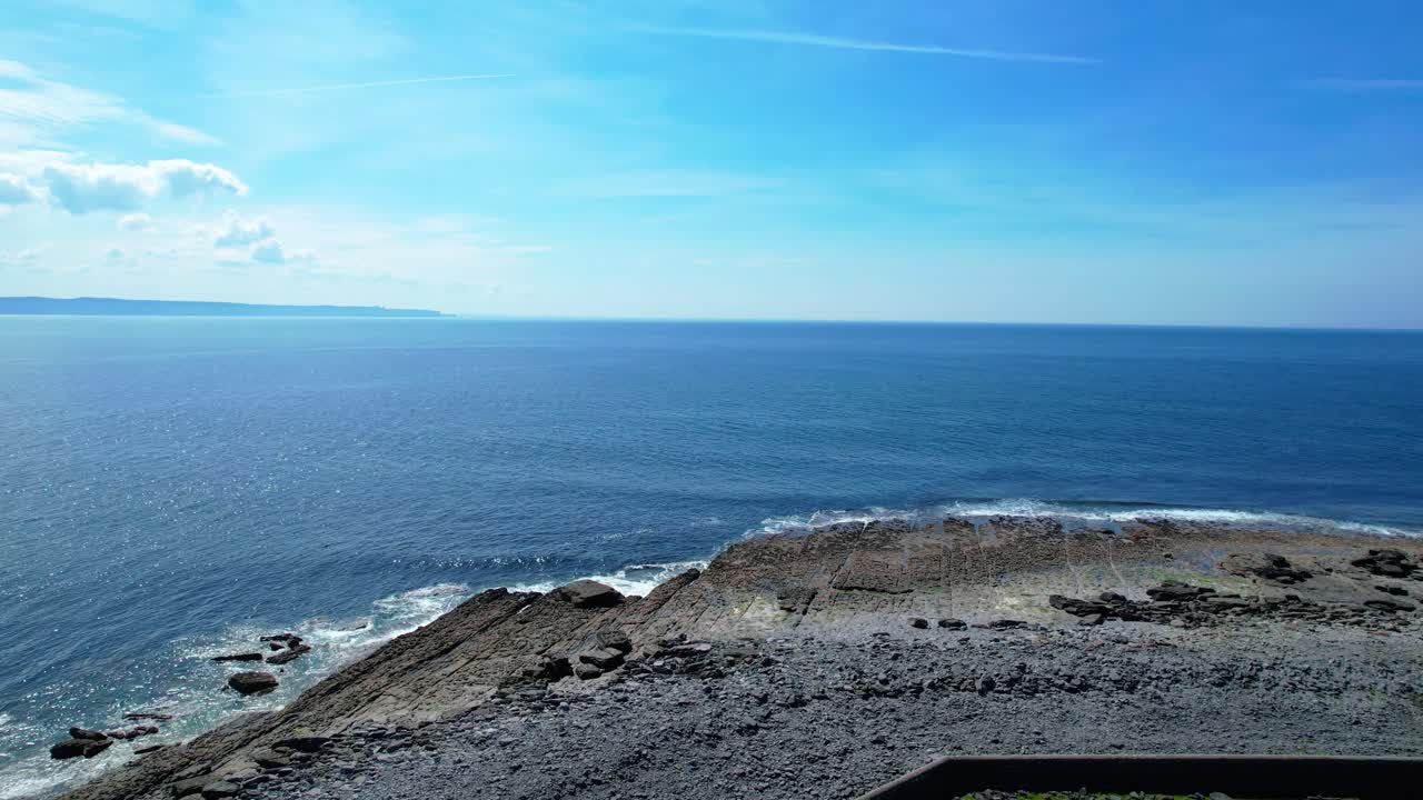 Drone flying past lighthouse Inisheer Aran Islands Ireland wild Atlantic way