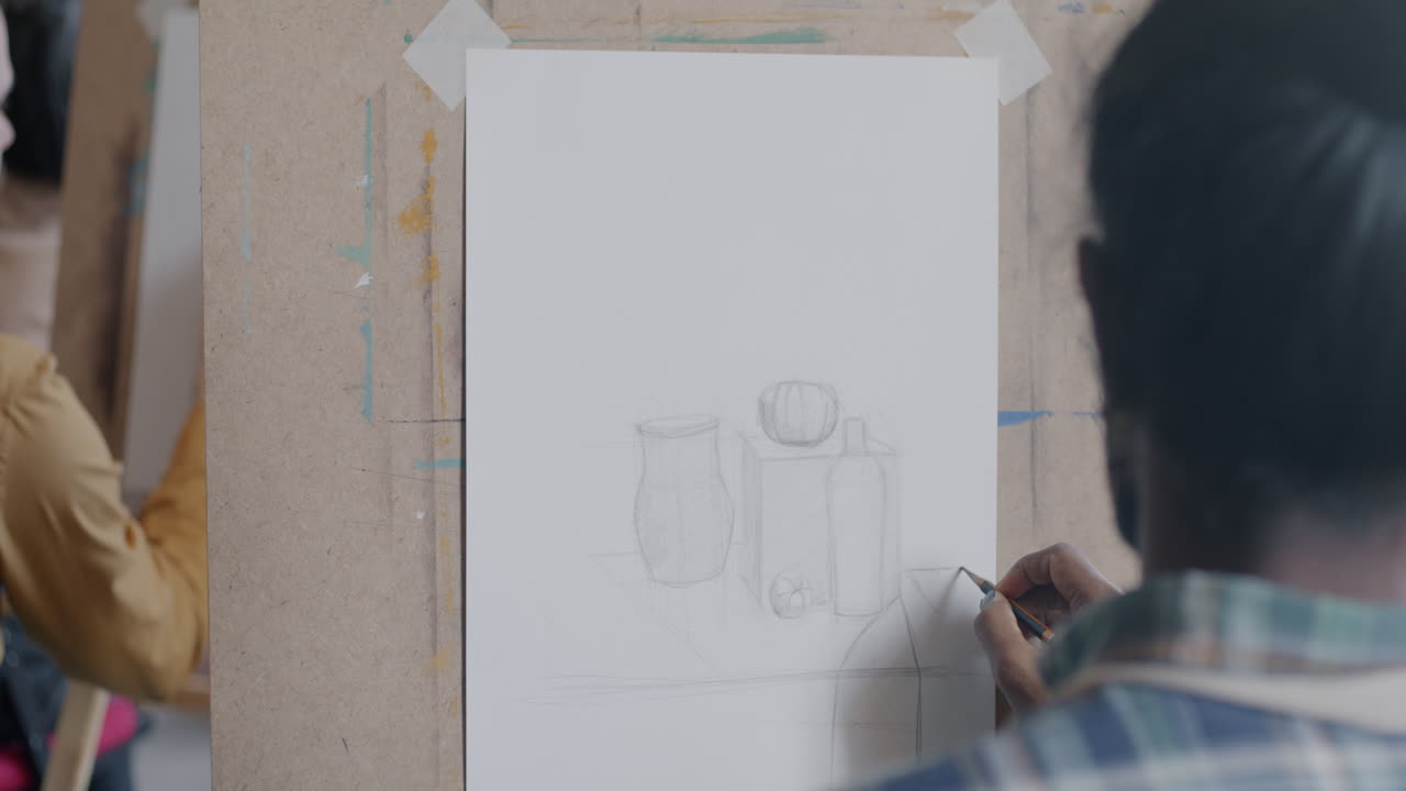 Student Drawing Still Life in an Art Class