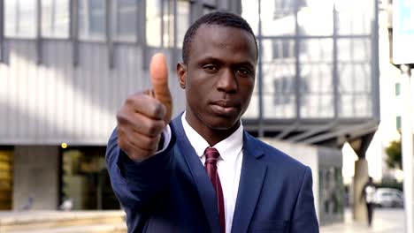 confident serious black african business man making thumb upman