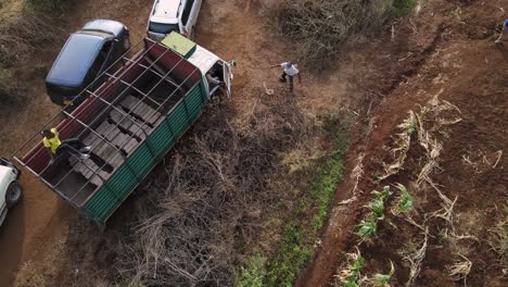 Aerial-drone-view-of-people-working-inside-the-lorry