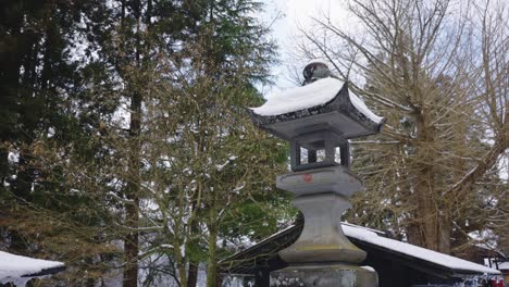 snow on japanese stone lantern at shrine, yamadera temple