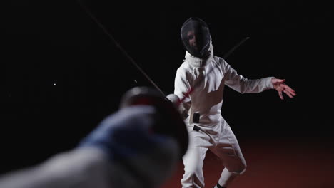 fencing match with focus on the sword