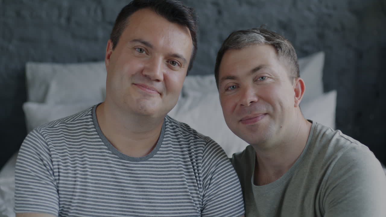 Happy Gay Couple in Bedroom