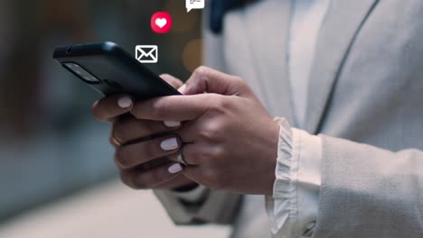 close up of muslim businesswoman standing outside city offices looking at mobile phone with motion graphics emojis showing multiple networking messaging and social media notifications