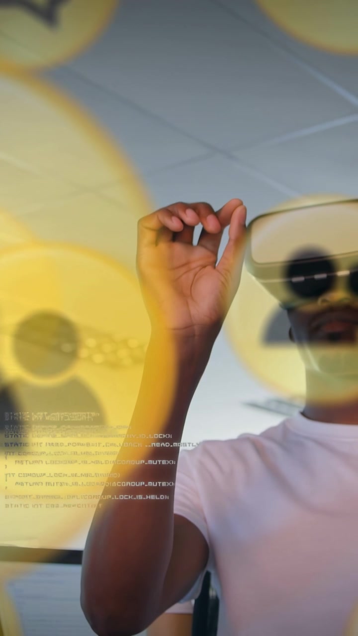 Vertical video: As icons focus, dev in VR headset raising hand pinching yellow icons to sort users
