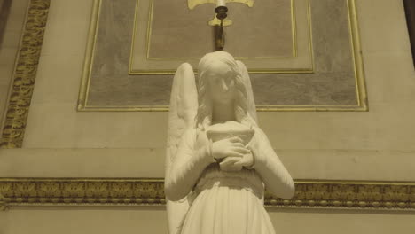 angel statue in church of la madeleine, paris in france
