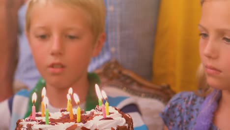 animation of caucasian siblings celebrating birthday party with cake