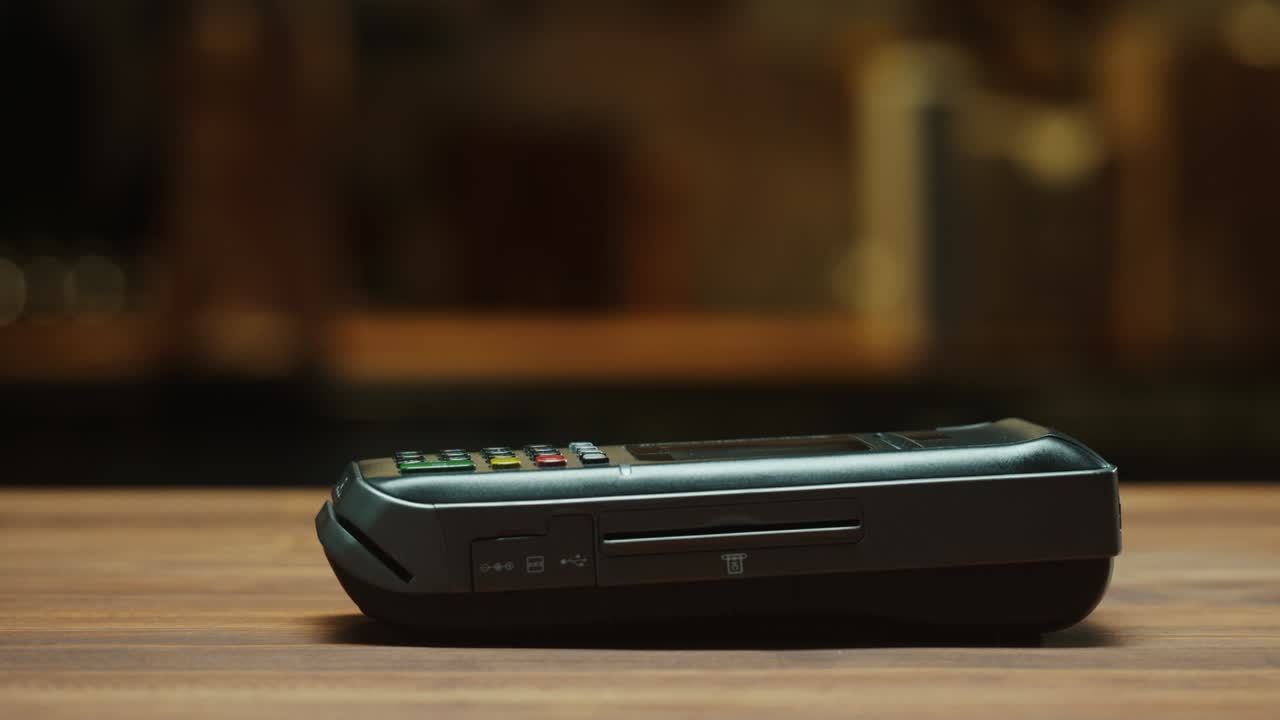 Paying with smartphone close-up. Cashless shopping in restaurant or cafe. Touch-free and contactless payment concept. NFC technology and bank terminal.