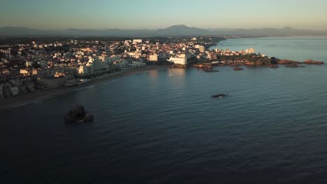 Biarritz-beach-and-cityscape-at-sunset,-France