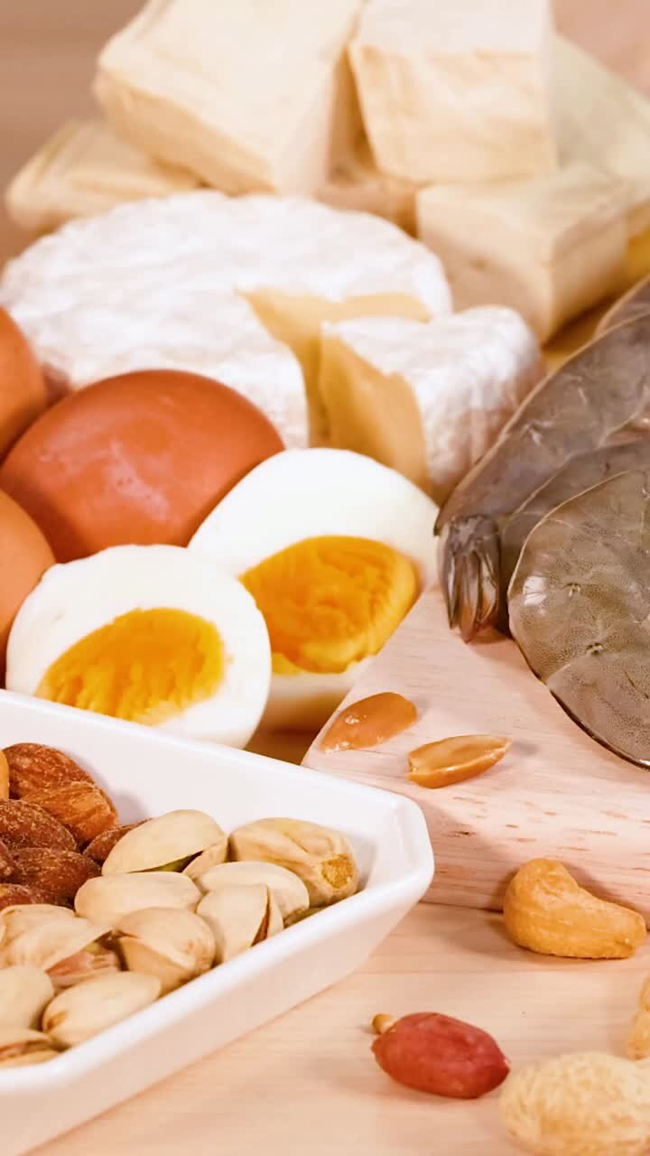 Variety of protein-rich foods on wooden surface