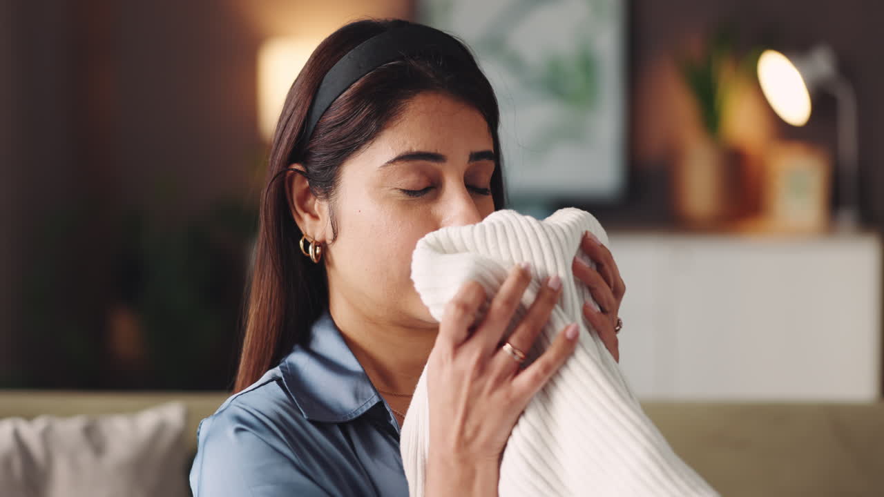 Woman holding a white sweater