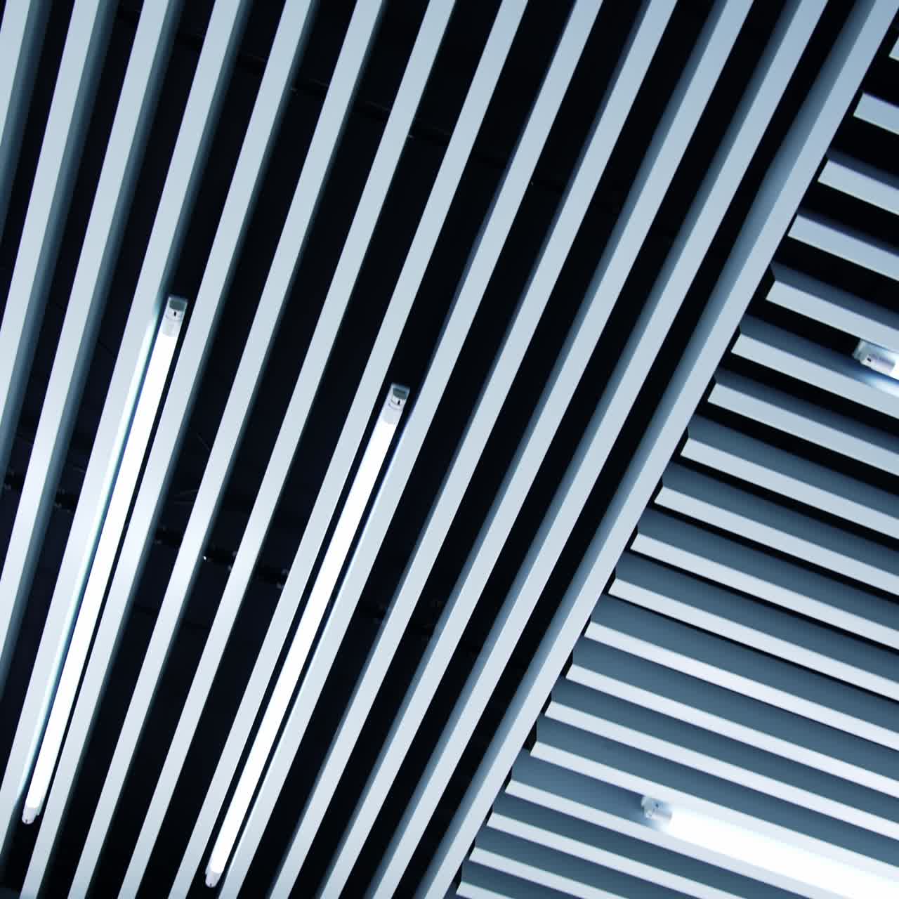 Geometric details in the design of the room. Long ledges with lamps of daylight among them