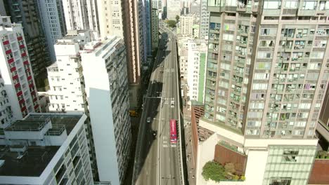 Downtown-Hong-Kong-city-skyscrapers-and-urban-traffic,-Aerial-view