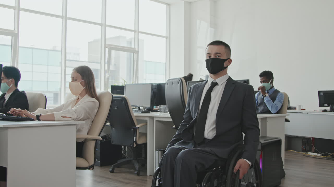 Portrait of Businessman in Wheelchair in Office