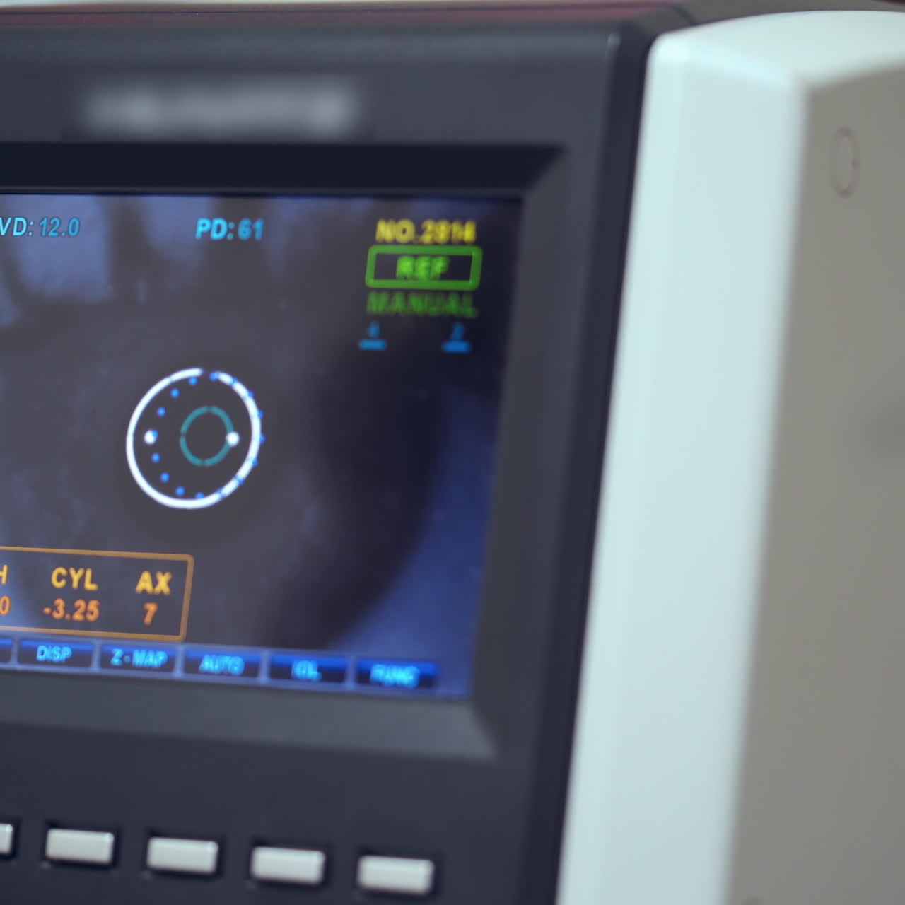 Auto refractometer testing human eye. Data screen showing progress of an eye examination. Vision concept.