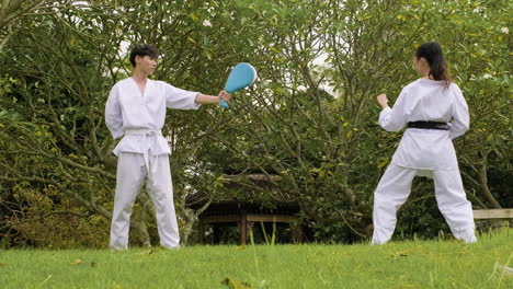 Young girl practising kicks