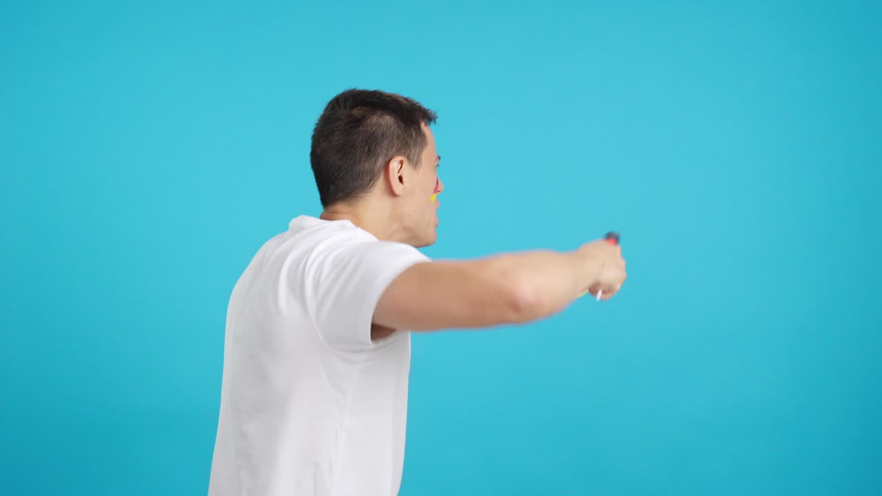 Rear view of a man waving a german pennant