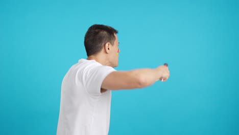 rear view of a man waving a german pennant