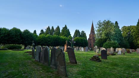 Summer-time-lapse-from-the-ancient-graveyard-of-St-Nicholas-church-in-the-Abbey-Fields-park-of-Kenilworth,-Warwickshire,-England,-UK