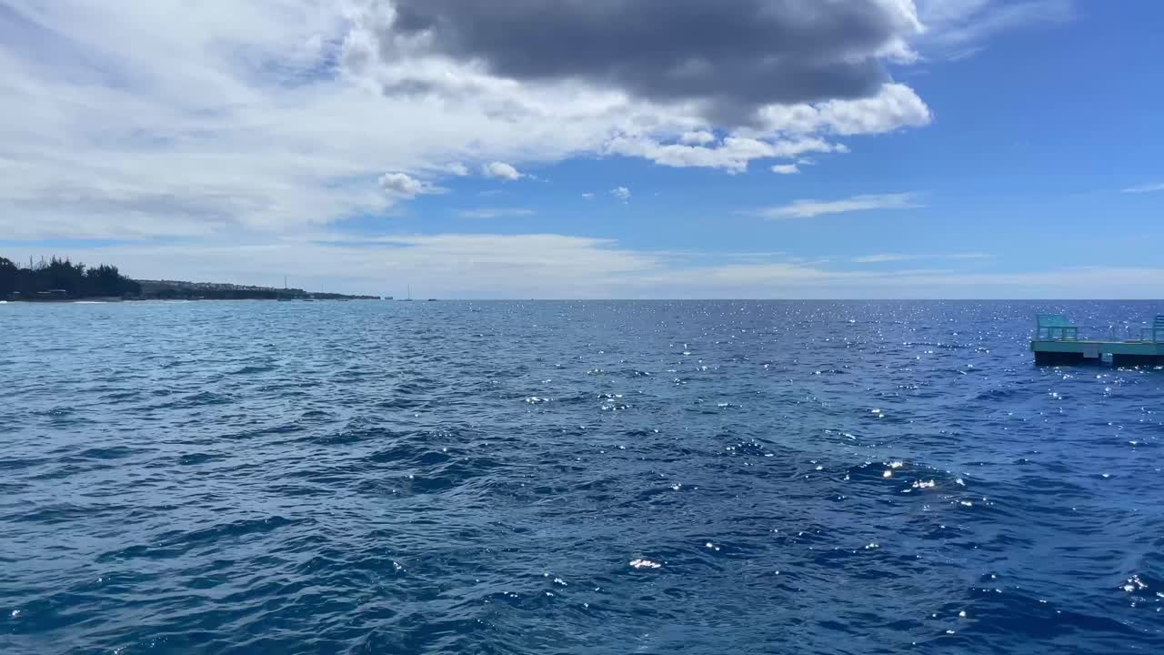 Ocean view from boat off coast of Barbados UHD