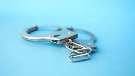 handcuffs on a blue background