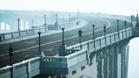 empty bridge overlooking the city in fog