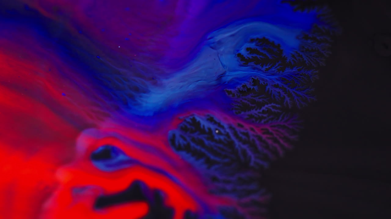 Vibrant ink mixing in fluid patterns, macro detail, abstract art vibe