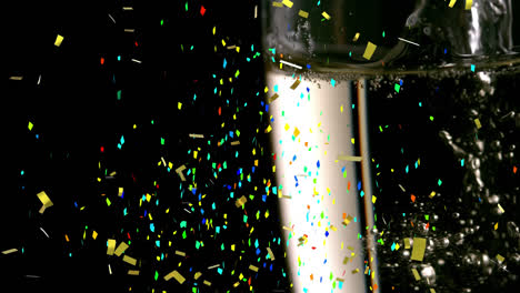 animation of multi coloured confetti falling against champagne flute