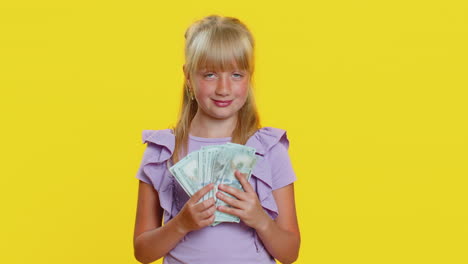 Rich-pleased-girl-child-kid-waving-money-dollar-cash-bills,-success,-lottery-winner,-income,-wealth