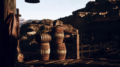 wooden barrels in a mountainous rural setting