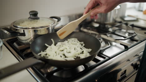 cooking onions on a gas stove