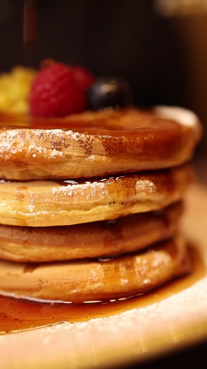 Stack of Pancakes with Berries and Maple Syrup